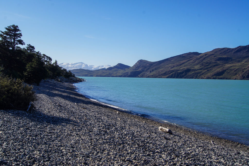 The rocky shores and turquoise waters of Lago Nordenskjöld in Torres del Paine, Patagonia, Chile