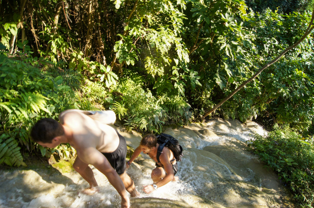 Britton and Harry nonchalantly walking up the steep and sticky Bua Tong Waterfall