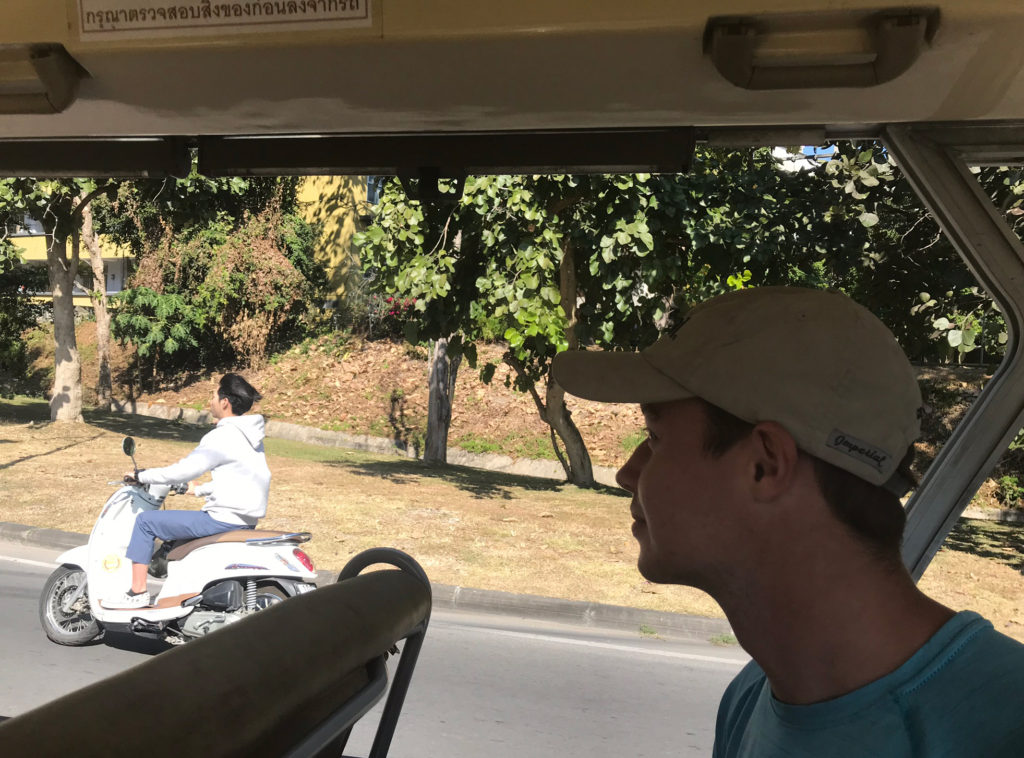 Britton, pretending to be a student in the shuttle bus at Chiang Mai University
