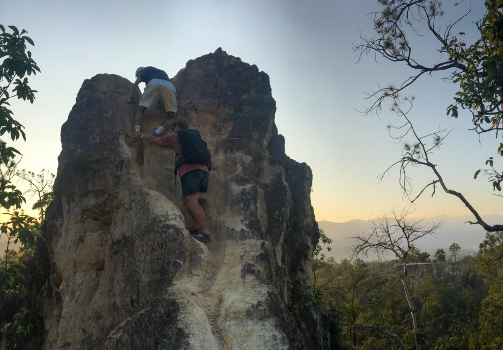 Me, with Harry's help, successfully climbing down from a dangerous ledge on the eroded off-shoot trails of Pai Canyon