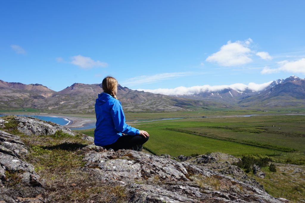 Véro meditating amongst the Icelandic mountains