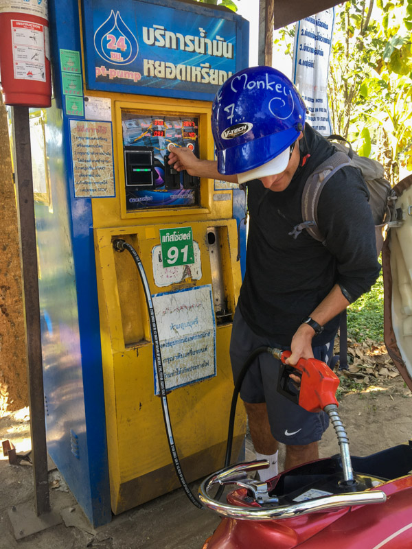 Me, pumping petrol from a gas vending machine in Pai. The machine would even play Thai music while pumping!