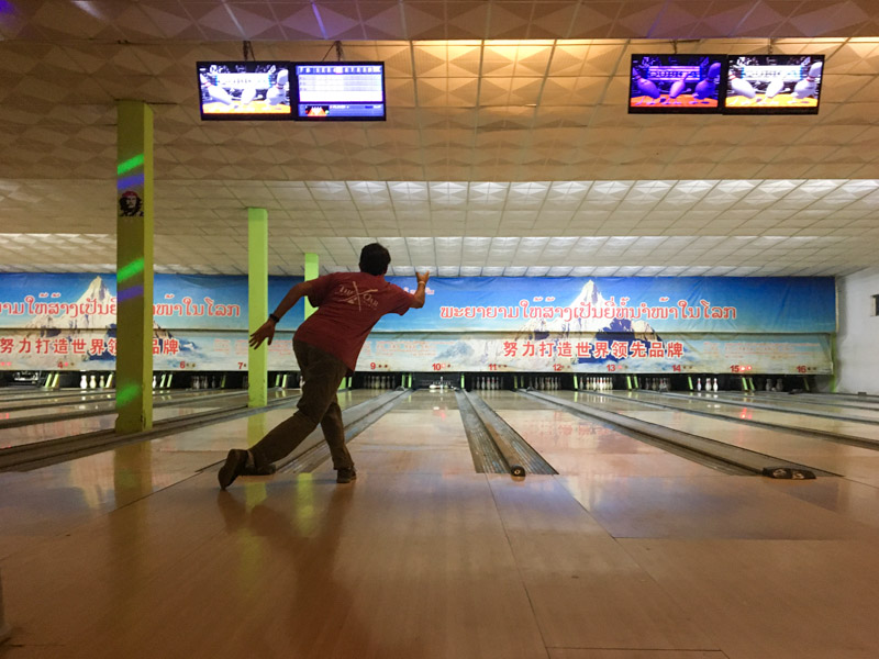 Look at that form! Everyone goes bowling in Luang Prabang, Laos