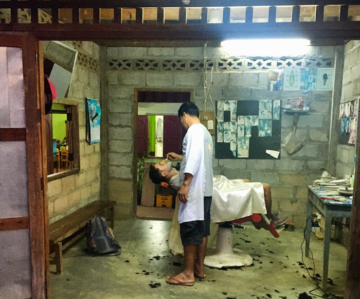 A travel memory I will not soon forget. Getting my first clean razor shave in a small village barbershop in the Laos countryside.